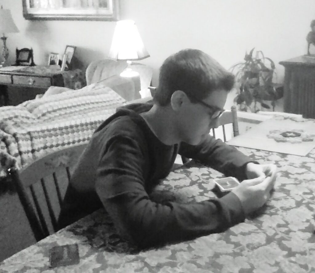 teenager playing cards