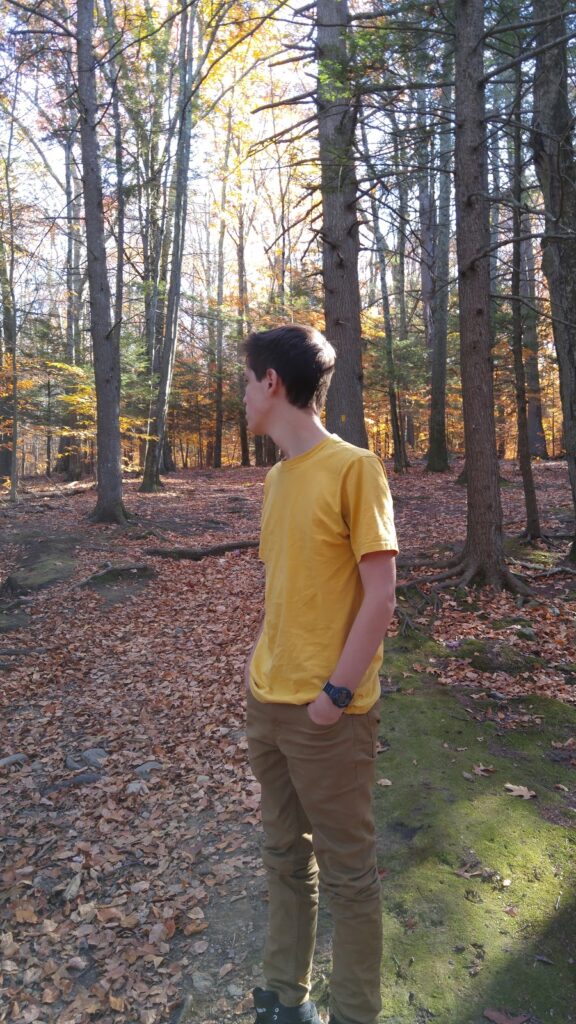 a boy in the woods