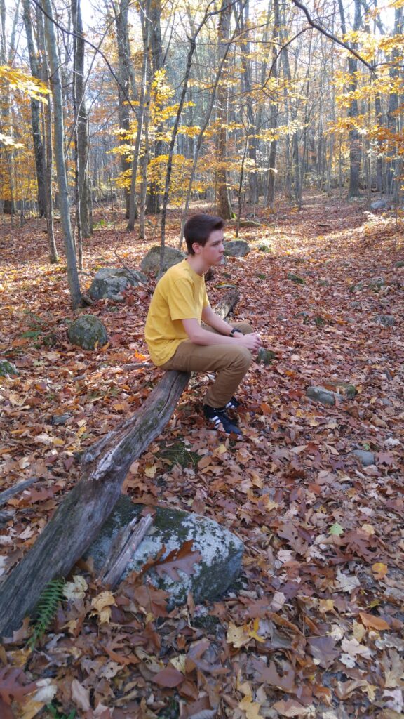 a boy in the woods