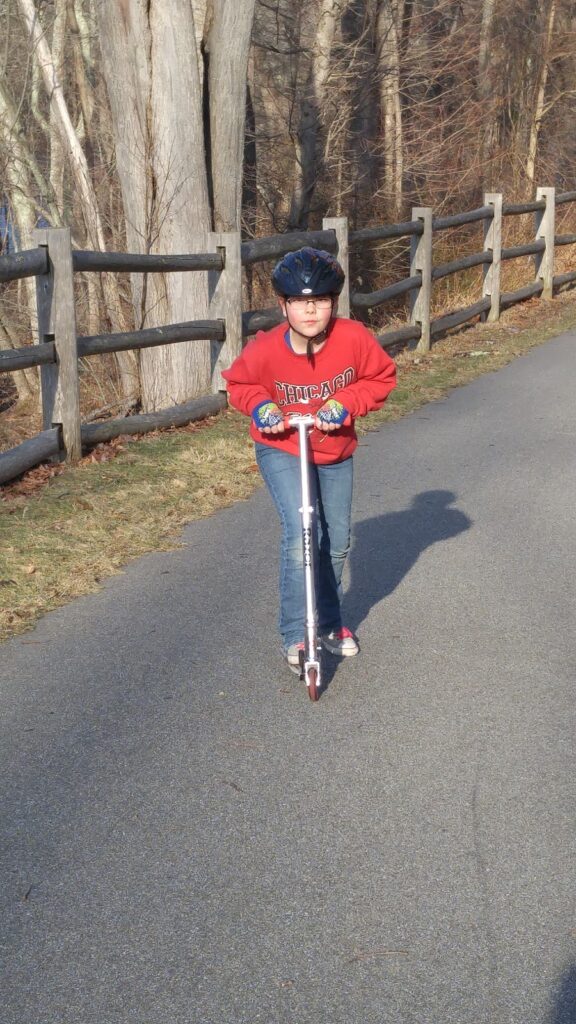 a girl and her scooter